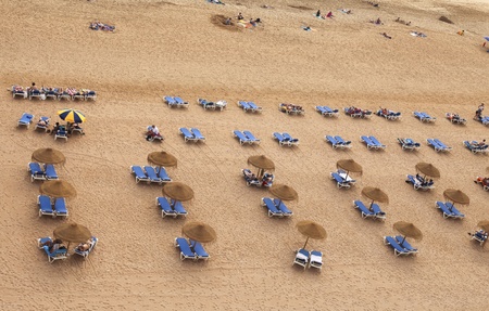  Beach beds and umbrellas at a beach in the Algarveのeditorial素材
