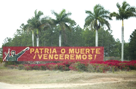 CUBA - Feb 28: Propaganda billboard near the road  Feb 28, 2011 in  Cuba. The billboard depicts...