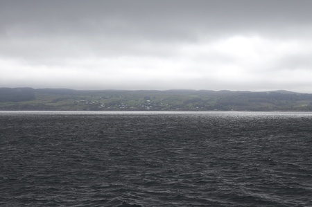 Isle of Skye in Scotland seen from a dark oceanの写真素材