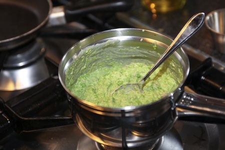 Mashy peas in a pan on the stoveの写真素材