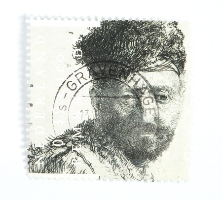 THE NETHERLANDS - CIRCA 2006: A Dutch stamp issued in 2006 showing the 1631 etch by Rembrandt ' Man with beard in eastern clothing' which is presumed to be his father , circa 2006の写真素材
