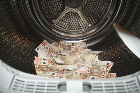 Euros inside washing machine. Concept for money launderingの写真素材