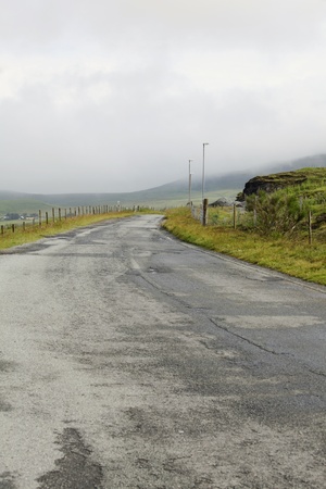 Damaged asphalt road on the Isle of Skyeの写真素材