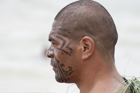 NEW ZEALAND-FEB 6:Maori warrior with fake tattoo at a Haka on Waitangi Day celebration,Feb 6, 2009. Waitangi day is a public holiday,yearly on Feb 6 to celebrate the signing of the Treaty of Waitangiのeditorial素材