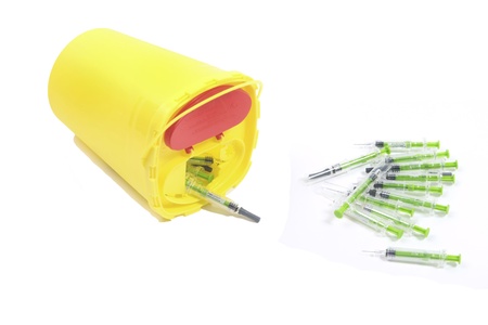 THE NETHERLANDS- JAN 27: Container for disposable syringes with a heap of used syringes. Medicine is  Fraxiparine used to prevent trombosisの写真素材