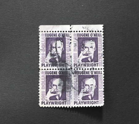 UNITED STATES OF AMERICA - CIRCA 1973: A block of four identical stamps printed in the United States of America showing Eugene O?Neill, American playwright and Nobel laureate in Literature, circa 1973 の写真素材