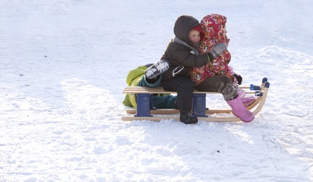 THE NETHERLANDS-FEB 4:Three small children on sleigh on ice on feb 4, 2012. February is the coldest month throughout the Netherlands with an average of -0.5¡C. This february although temperatures dropped to a minus 20 ¡C which is exceptionally cold for thのeditorial素材