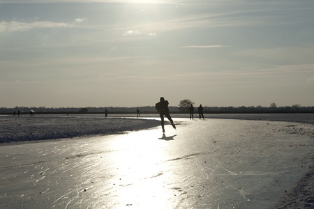 THE NETHERLANDS-FEB 9: Ice skaters on frozen lake practising for the " round of Duurswold" in the north of Holland., 80 km skating race on feb 9 2012. ' This february  temperatures dropped in the netherlands to an exceptionally low - 20 ¡Cのeditorial素材