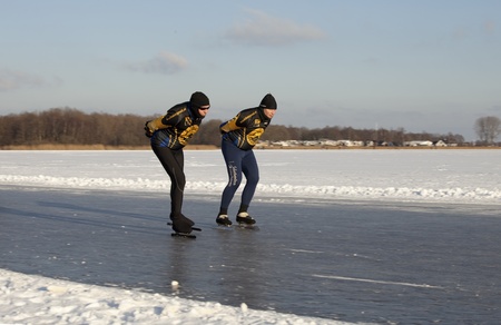 THE NETHERLANDS-FEB 9: Ice skaters on frozen lake practising for t the " round of Duurswold in the north of Holland., 80 km skating race on feb 9 2012. ' This february  temperatures dropped in the netherlands to an exceptionally low - 20 ¡Cのeditorial素材