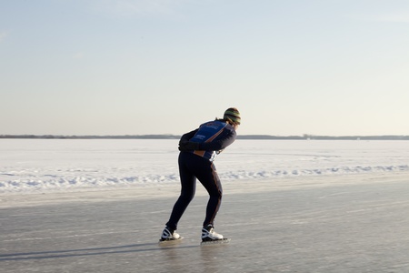 THE NETHERLANDS-FEB 9: Female speed skater practices for the famous 150 kilometer Noorderrondrit  on natural ice on February 9, 2012 in Groningen. This february  temperatures dropped in the netherlands to an exceptionally low - 20 ¡Cのeditorial素材