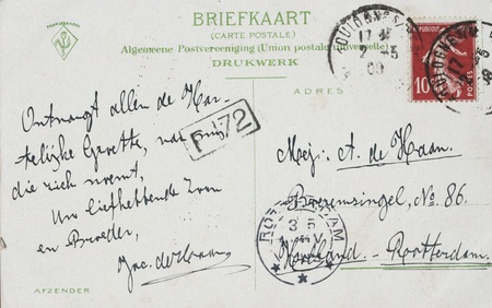 Vintage postcard with address in the Netherlands and 10 centimes french stamp postmarked in 1908のeditorial素材