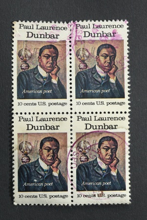 USA - CIRCA 1975 : A block of four identical stamps printed in the USA shows Paul Laurence Dunbar, American Poet, circa 1975 のeditorial素材
