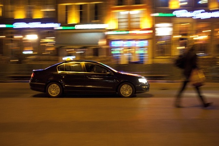 Car at night in Dutch city with motion blurの写真素材
