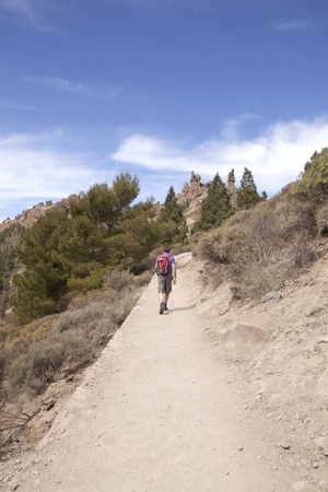 Man on footpath in mountainsの写真素材