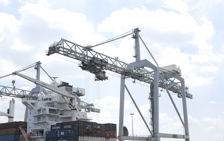 NETHERLANDS- JUNE 26: Crane in harbor of Rotterdam on June 26, 2012. Rotterdam is the largest port in Europe and the number three busiet port in the world only surpassed by Shanghai and Singapore.  A large extension of the port of Rotterdam (Maasvlakte 2)のeditorial素材