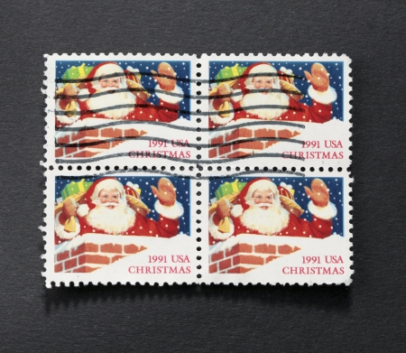 UNITED STATES - CIRCA 1991  Block of four postage stamps printed by United states, showing Santa Claus, circa 1991の写真素材