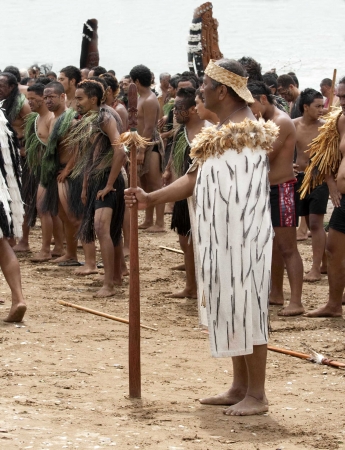 WAITANGI, NZ - FEB 6: Maori chief standing amidst maori warriors at a Haka on Waitangi Day celebration,Feb 6, 2009. Waitangi day is a public holiday,yearly on Feb 6 to celebrate the signing of the Treaty of Waitangiのeditorial素材