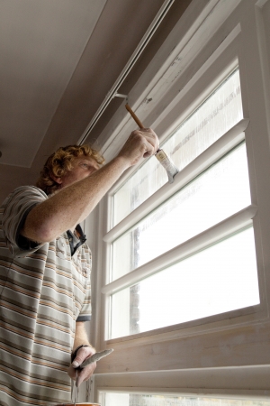 Painter at work inside a homeの写真素材