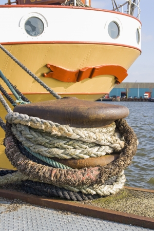 dock with ropes and old shipの写真素材