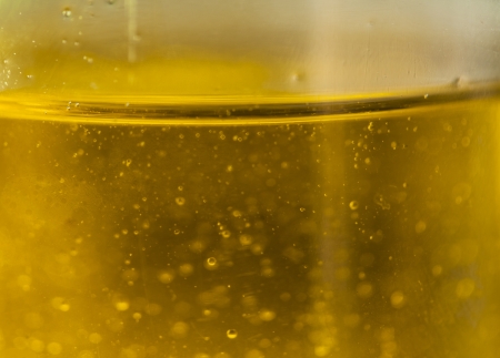 Close up of virgin olive oil in a bottleの写真素材