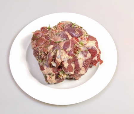 Raw leg of lamb with rosemary, garlic and pancettaの写真素材