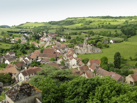View on the town of Rochepot in Burgundy with its 12th century old Roman church and cemeteryの写真素材