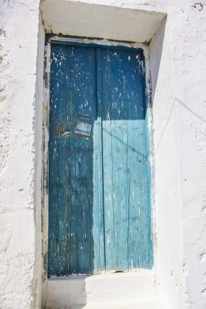 Old and weathered blue door the mediterraneanの写真素材