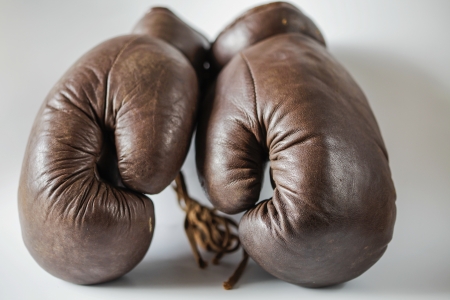 Pair of old brown leather boxing gloves of the 1950'sの写真素材