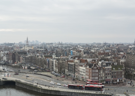 AMSTERDAM, NETHERLANDS - JAN 18,2014: Historic buildings and busses in the center of Amsterdam. The country's largest city is visited by over 3,5 million foreign tourists a year.

のeditorial素材