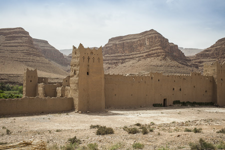 Clay fort in the desert in Moroccoの写真素材