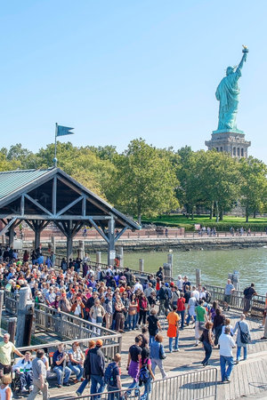 NYC, USA-SEPT 23: Tourists waiting at Liberty Island for the ferry back to Lower Manhattan on Sept 23, 2008のeditorial素材