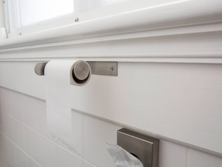 Toilet paper on a roll in a white toiletの写真素材