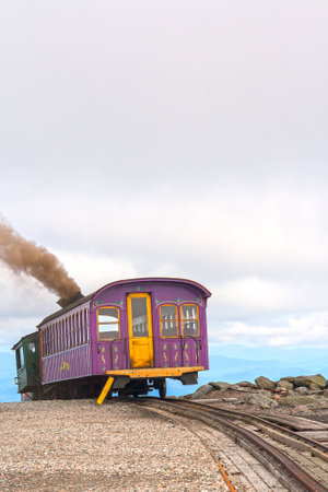 The cog train up Mount Washington is one of the steepest railways and the first (1869) mountain climbing railway in existence. It uses 1000 kilos of coals for the return trip to Mount Washington.の素材 [FY31026883250]