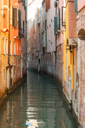 Small canal with houses in Venice, Italyの写真素材