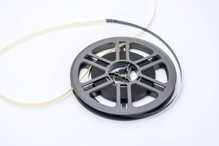 Old fashioned plastic film reel with 8 mm filmの写真素材