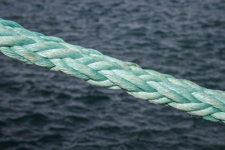 Blue rope and waterの写真素材