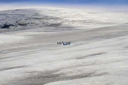 Dog sledding tour on a glacier in icelandの写真素材
