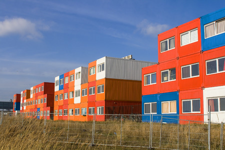multi colored houses in red and orange and blue in Amsterdamの写真素材