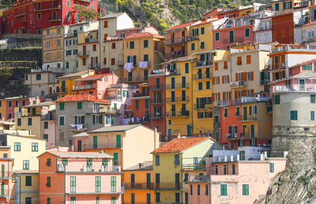 beautiful town of Corniglia in cinqueterre in Italy with many colorful houses built on a cliffの写真素材