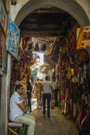 FEZ, MOROCCO-MAY 7: Narrow street in the medina of Fez on May 7, 2013. Fes is a historic city listed in UNESCO and a tourist destination.のeditorial素材