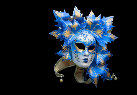 Venetian mask in blue and gold on a black backgroundの写真素材