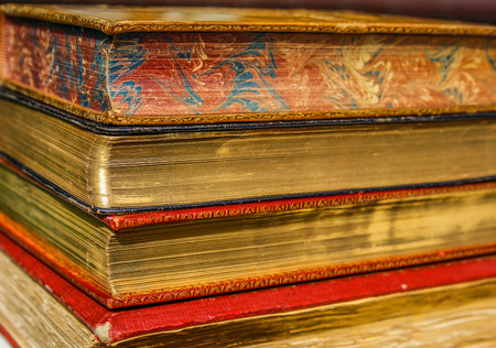 vintage books with special coating of gold on pagesの写真素材