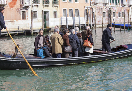 VENICE, ITALY - MARCH 14: Local Venetians cross standing the Grand Canal via Traghetto on March 14, 2014. A Traghetto is a cheap way of crossing the grand canal in Venice. のeditorial素材