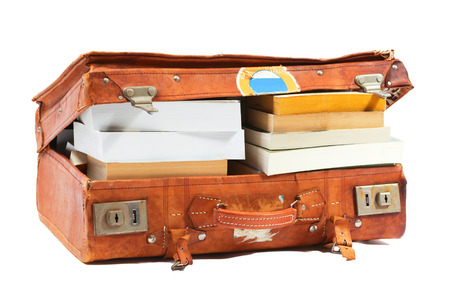 Old leather suitcase filled with books

の写真素材