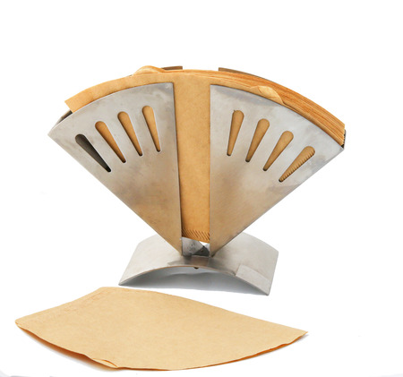 Brown coffee filters in stainless steel coffee holderの写真素材