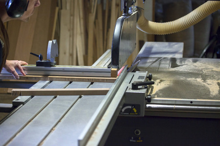 Carpenter working with circular saw bladeの写真素材