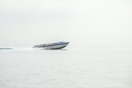 PARACAS -PERU CIRCA JULY 2014: A boat with tourists sailing on the sea on July 8, 2014 in Paracas. Tourist boats take people to Islas Ballestas every day to observe different species of marine animals.

のeditorial素材