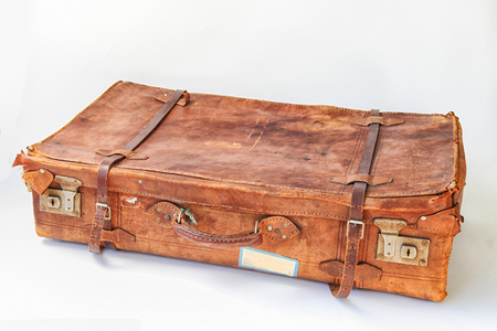 Vintage weathered leather suitcases sideviewの写真素材
