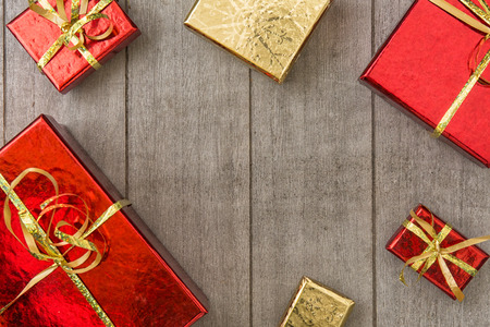 Concept for holidays with gifts on wooden backgroundの写真素材