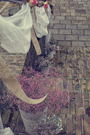 Lanterns and flowers on a staircase decorated for a weddingの写真素材